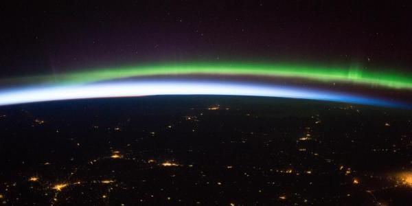 Earth sunrise, aurora and cities in northern Europe