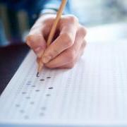 student filling a scantron test